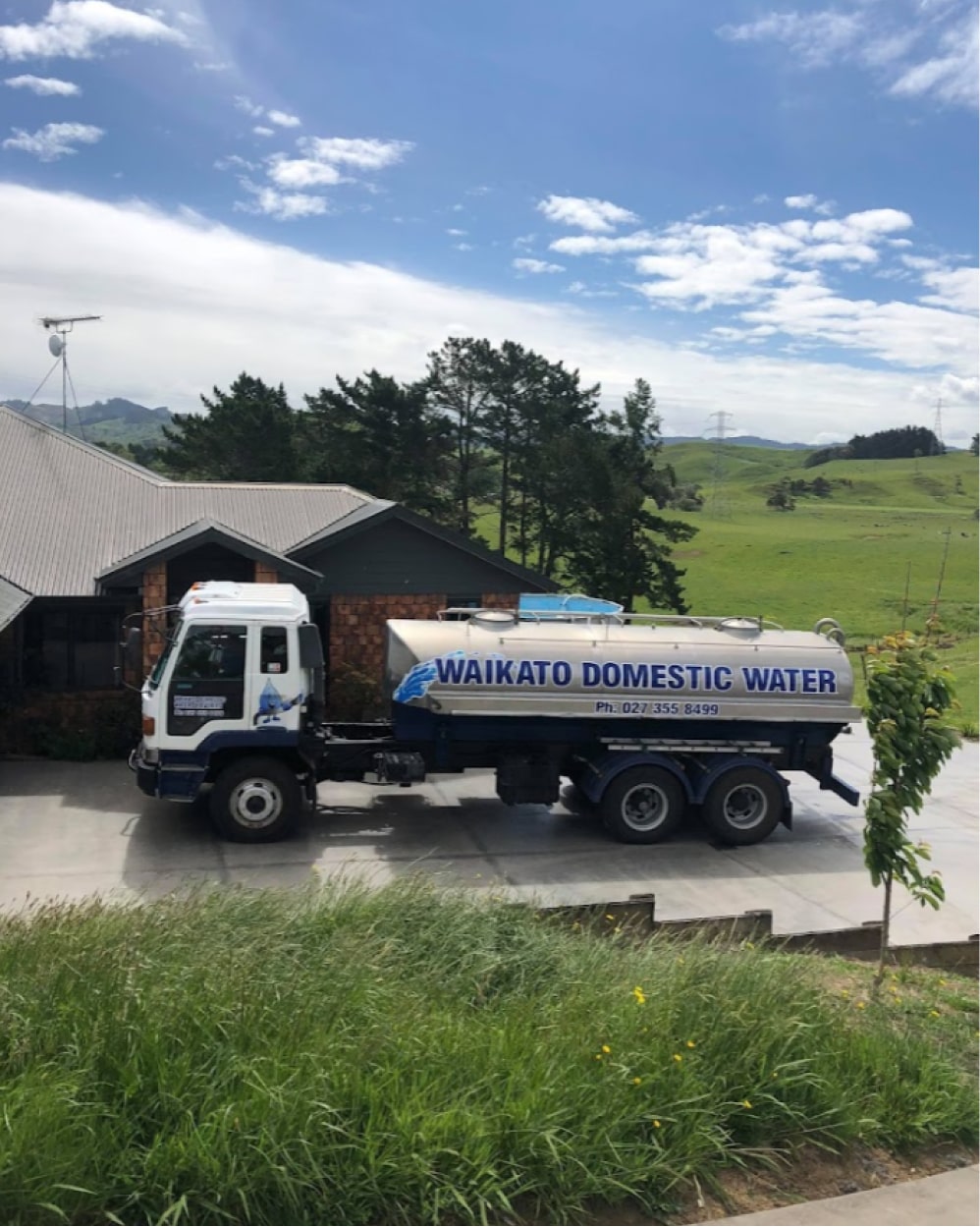 Water Being Delivered to Residential House on Driveway